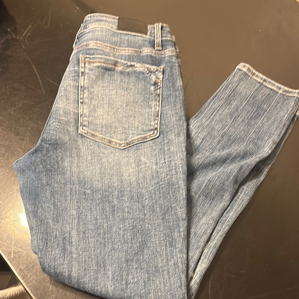 Buckle black ripped skinny jeans like new.